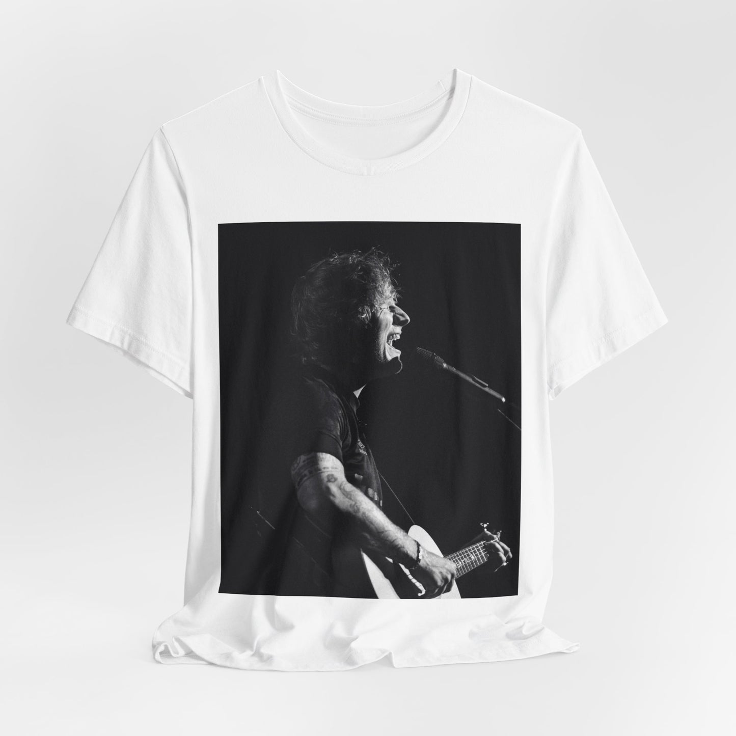 A black graphic t-shirt featuring a graphic related to Ed Sheeran's stadium tour.
