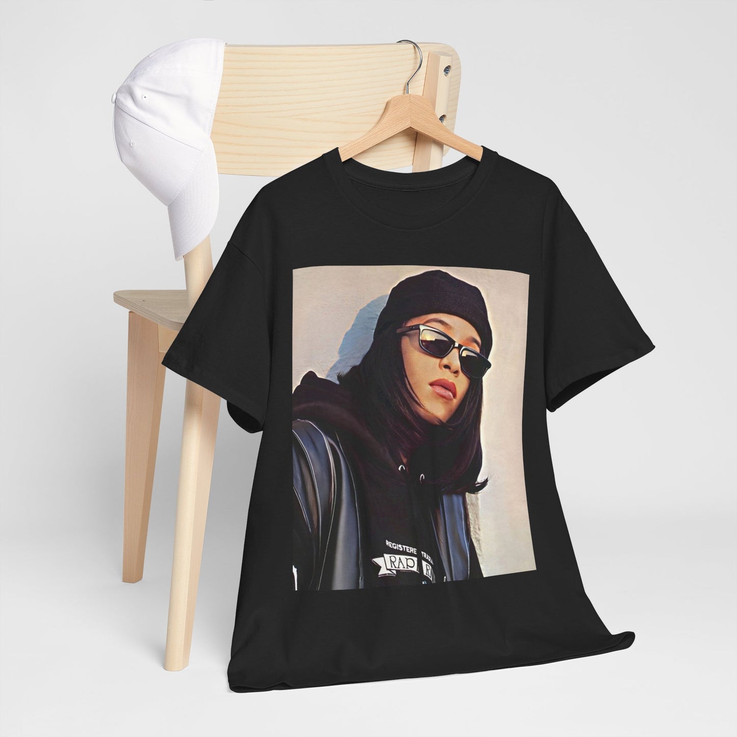 A black graphic t-shirt featuring a rap underground princess graphic of Aaliyah.