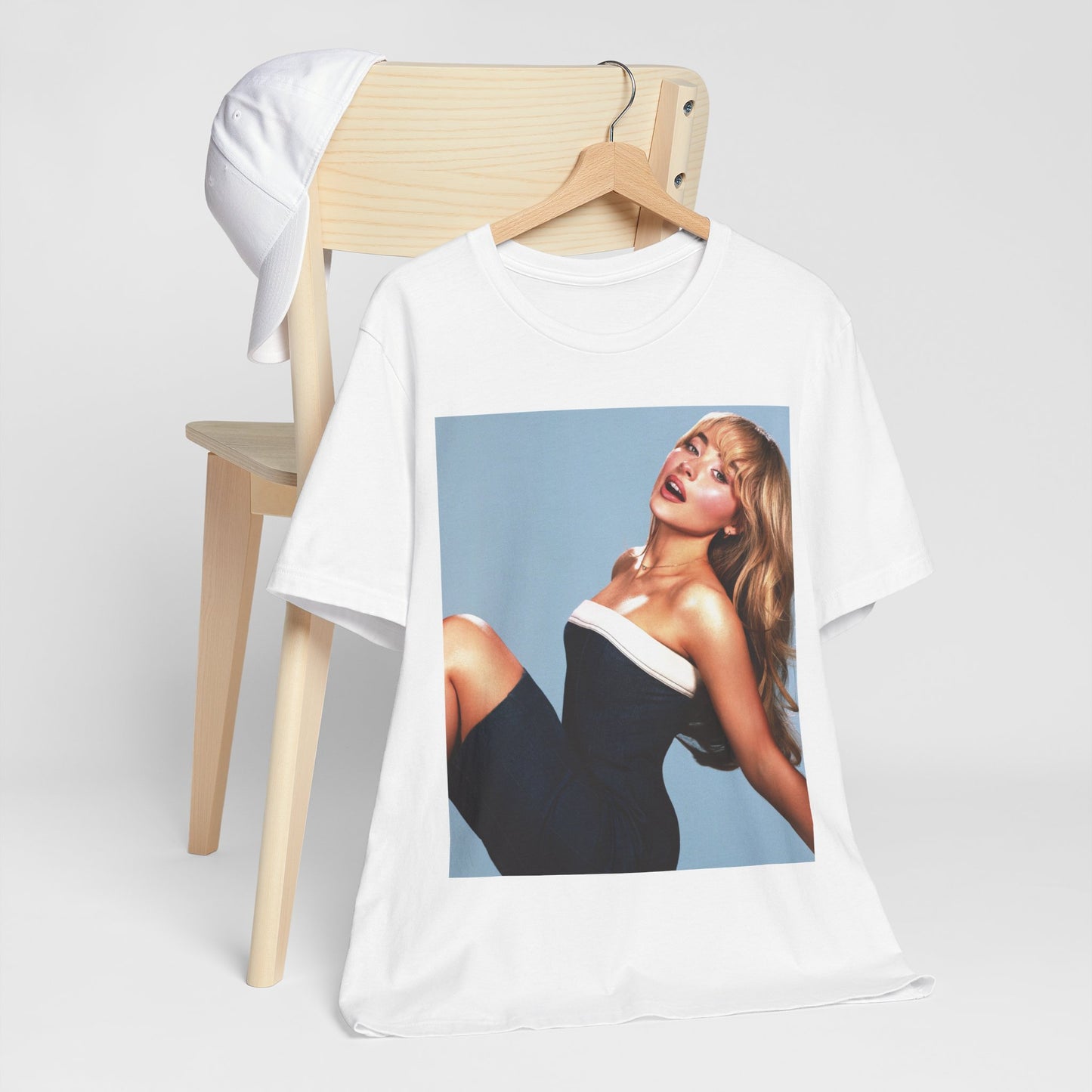A black graphic t-shirt featuring a graphic related to Sabrina Carpenter's 'Espresso' song or era.