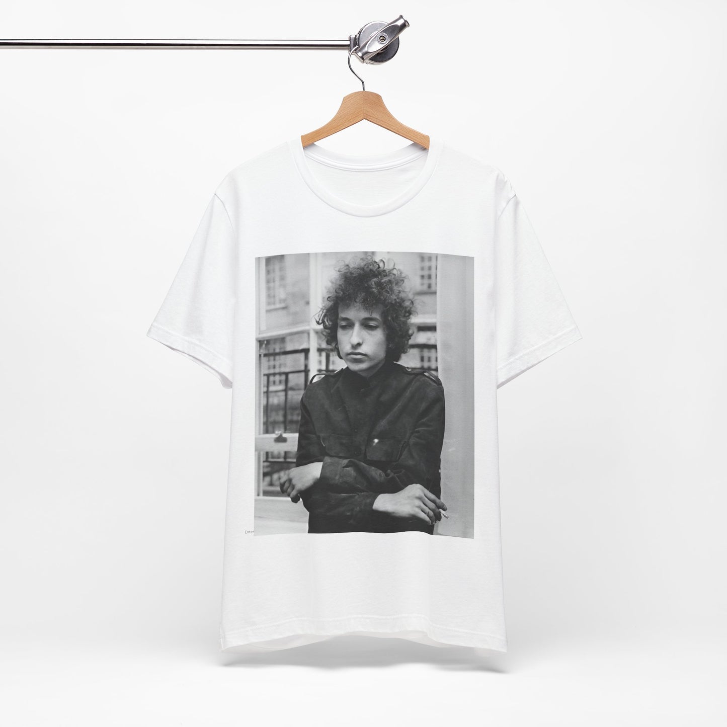A black graphic t-shirt featuring a black and white graphic of Bob Dylan from the folk revival era.
