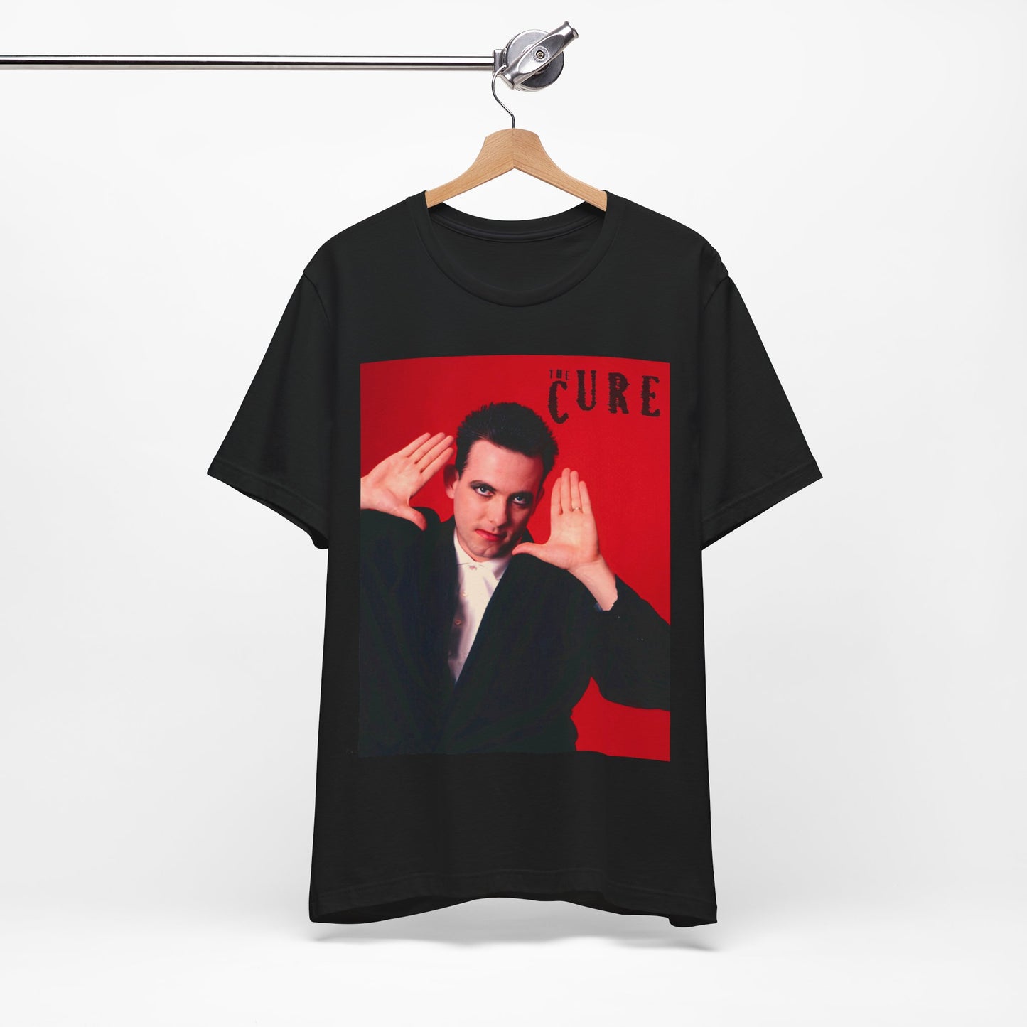 A black graphic t-shirt featuring a graphic of Robert Smith from The Cure in his authentic style.
