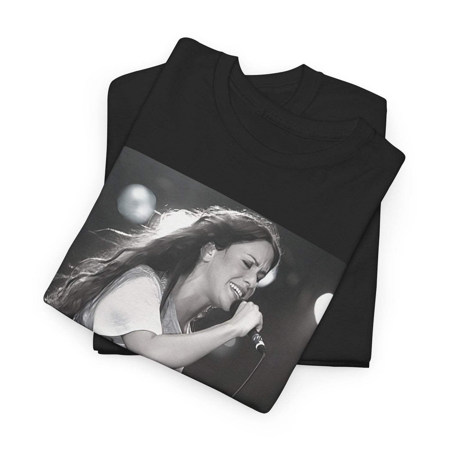 A black graphic t-shirt featuring a photo of Alanis Morissette performing live on stage in the 1990s, with a dynamic expression.