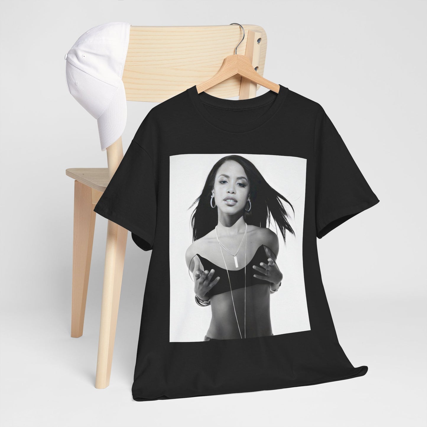 A black graphic t-shirt featuring a black and white graphic of Aaliyah as an urban princess.