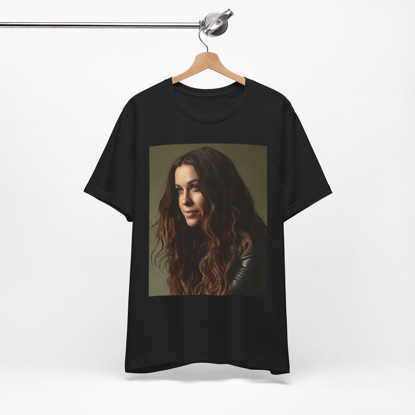 A black graphic t-shirt featuring a close-up portrait photo of Alanis Morissette, showing her intense or contemplative expression.