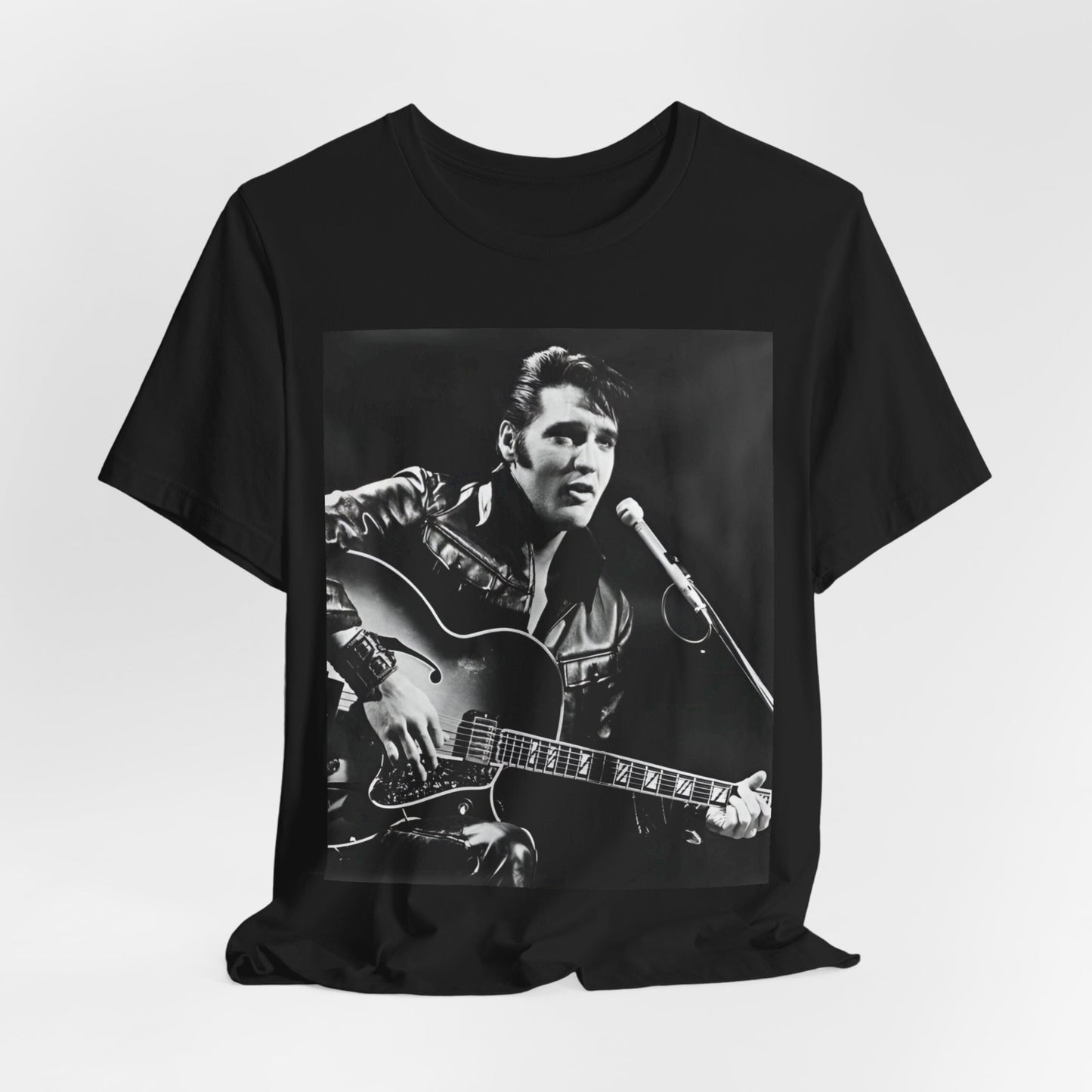 A black graphic t-shirt featuring a graphic related to Elvis Presley's 'Burning Love' song or era.