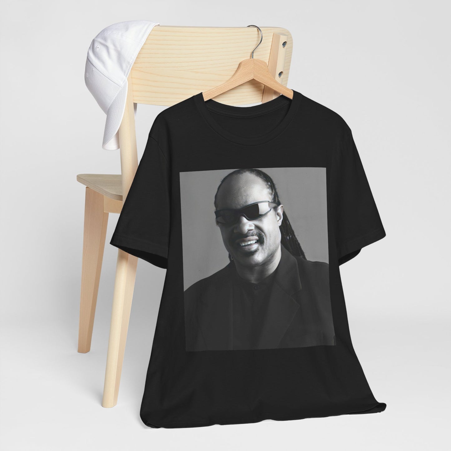 A black graphic t-shirt featuring a classic Motown legend black and white graphic of Stevie Wonder.