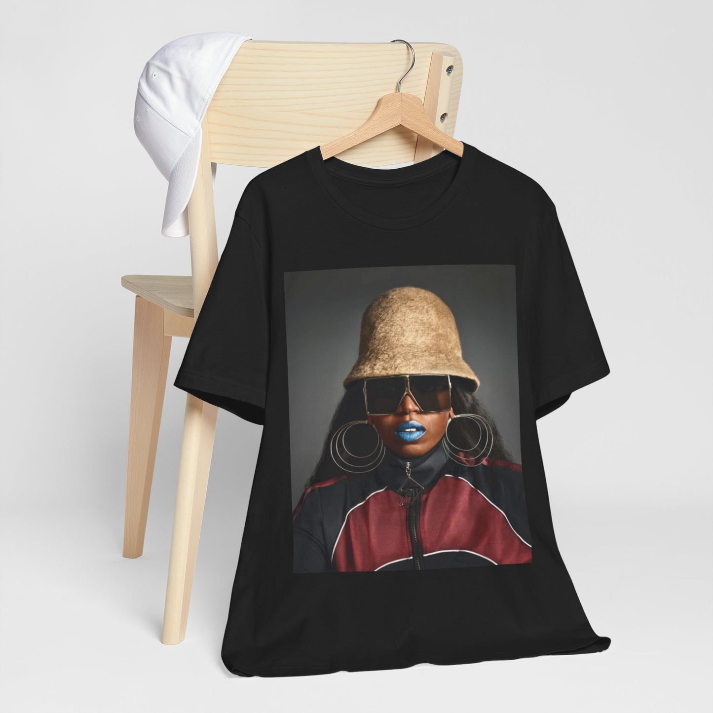 A black graphic t-shirt featuring a vintage hip hop icon graphic of Missy Elliott.