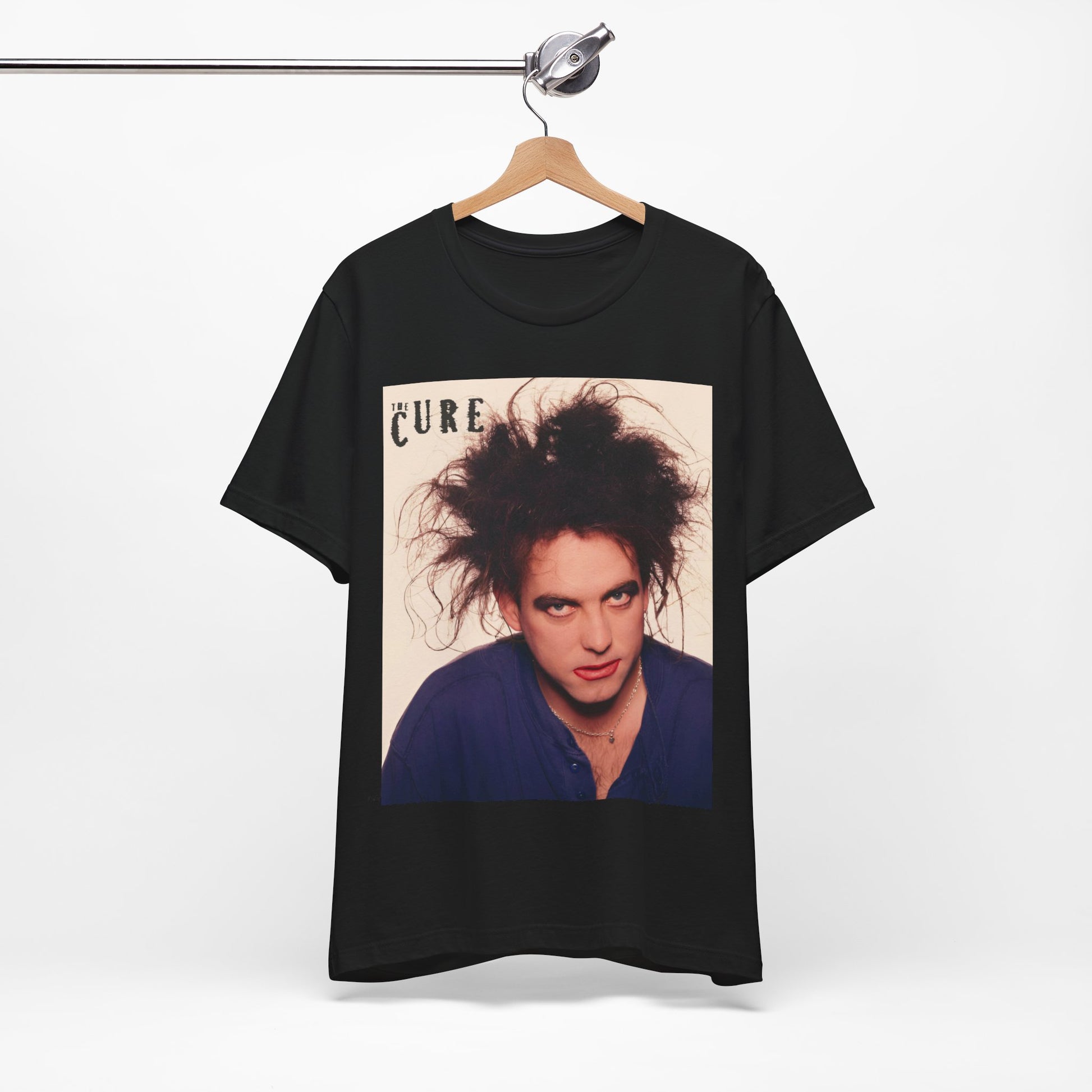 A black graphic t-shirt featuring a photo portrait of Robert Smith from The Cure.
