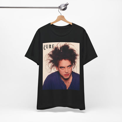 A black graphic t-shirt featuring a photo portrait of Robert Smith from The Cure.