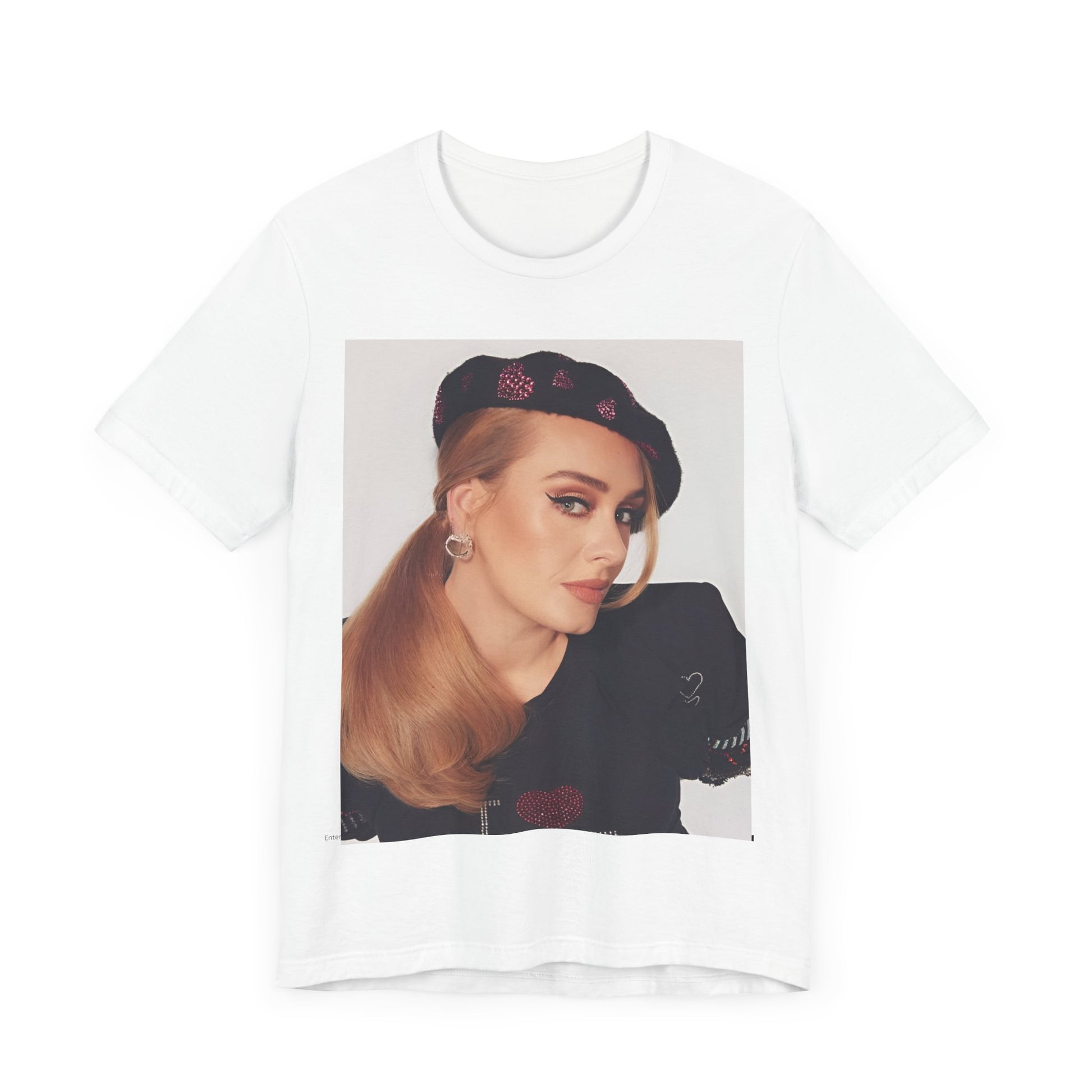 A black graphic t-shirt featuring a black and white photo of Adele wearing a heart-shaped beret, with a gentle or smiling expression.
