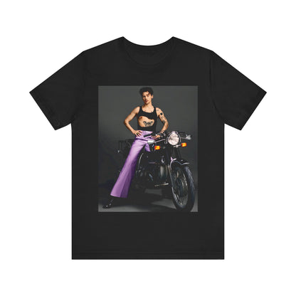 A black graphic t-shirt featuring a graphic of Harry Styles related to motorcycles or a rebellious, cool style.