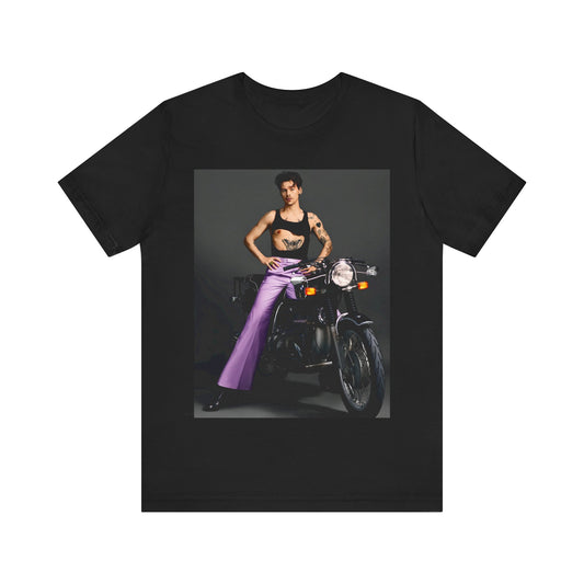 A black graphic t-shirt featuring a graphic of Harry Styles related to motorcycles or a rebellious, cool style.