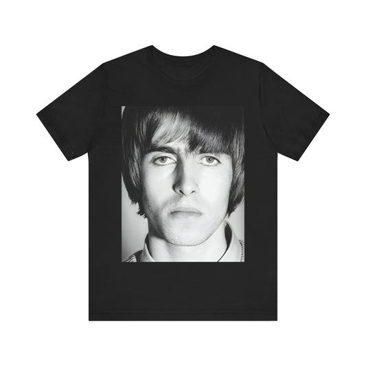 A black graphic t-shirt featuring a 90s portrait photo of Liam Gallagher from Oasis.