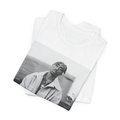 A black graphic t-shirt featuring a graphic related to Tupac's 'Thug Life' philosophy.