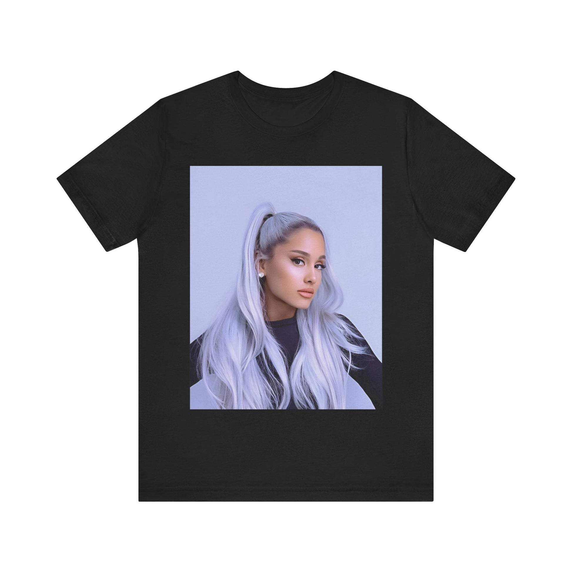 A black graphic t-shirt featuring a stylized graphic of Ariana Grande, possibly with a crown or 'Pop Queen' text, emphasizing her iconic status.