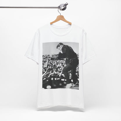 A black graphic t-shirt featuring a retro photo of Elvis Presley performing live in concert in the 1950s.