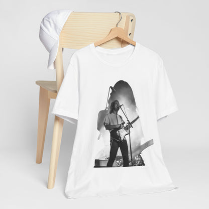 A black graphic t-shirt featuring a black and white, monochrome graphic or photo of Tame Impala.