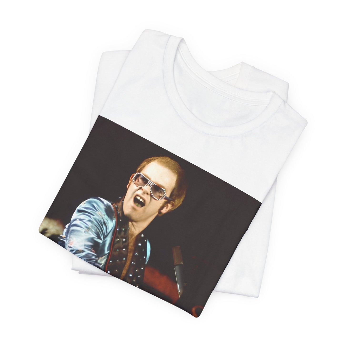 A black graphic t-shirt featuring a retro graphic related to Elton John's 'Rocket Man' song or era.