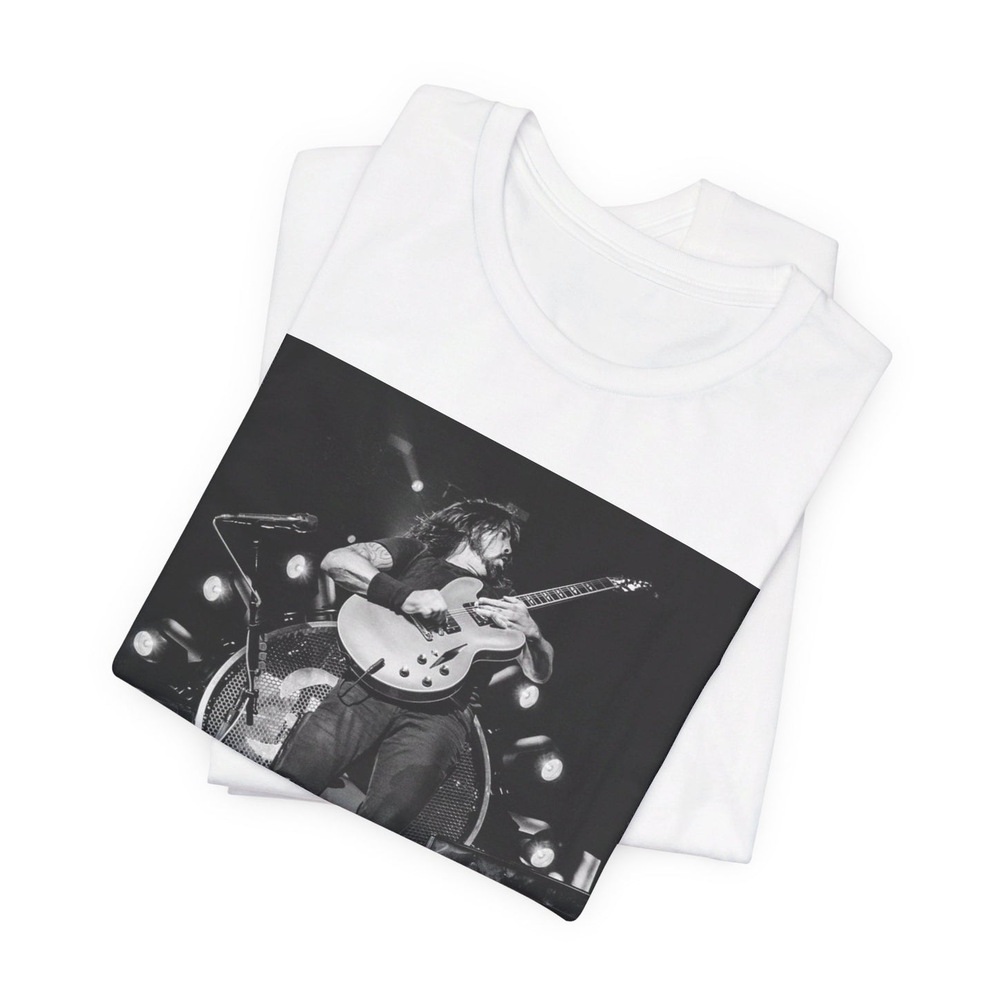 A black graphic t-shirt featuring a vintage photo of Foo Fighters performing live.
