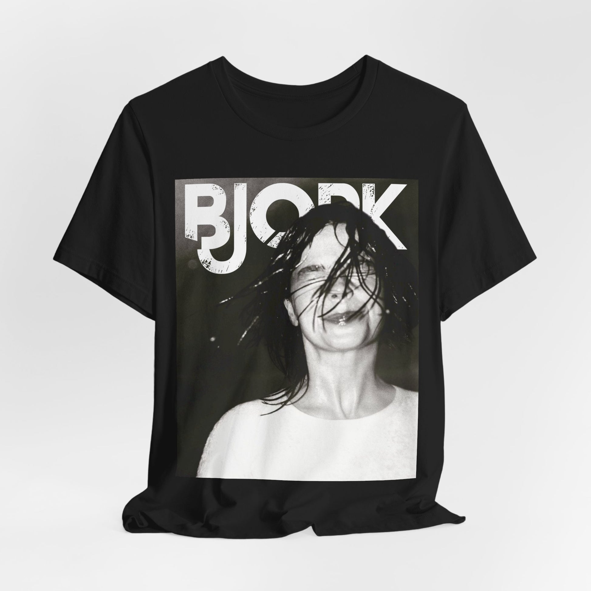 A black graphic t-shirt featuring a dark, artistic graphic of Bjork, possibly with a mysterious or otherworldly feel.