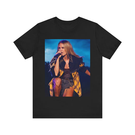 A black graphic t-shirt featuring a stylized graphic of Carrie Underwood, designed with a modern country aesthetic.