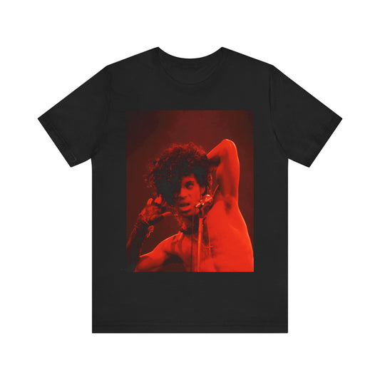 A black graphic t-shirt featuring a concert pop fan graphic of Prince.