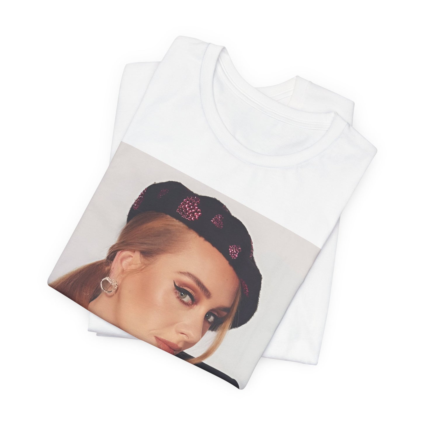 A black graphic t-shirt featuring a black and white photo of Adele wearing a heart-shaped beret, with a gentle or smiling expression.