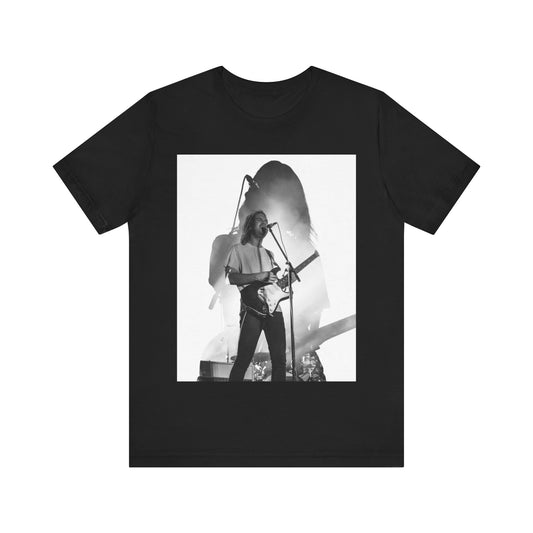 A black graphic t-shirt featuring a black and white, monochrome graphic or photo of Tame Impala.