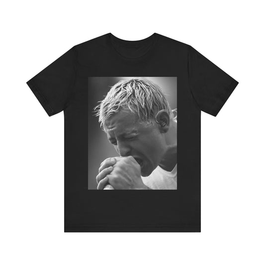A black graphic t-shirt featuring a graphic or photo of Chester Bennington from Linkin Park performing live on stage.
