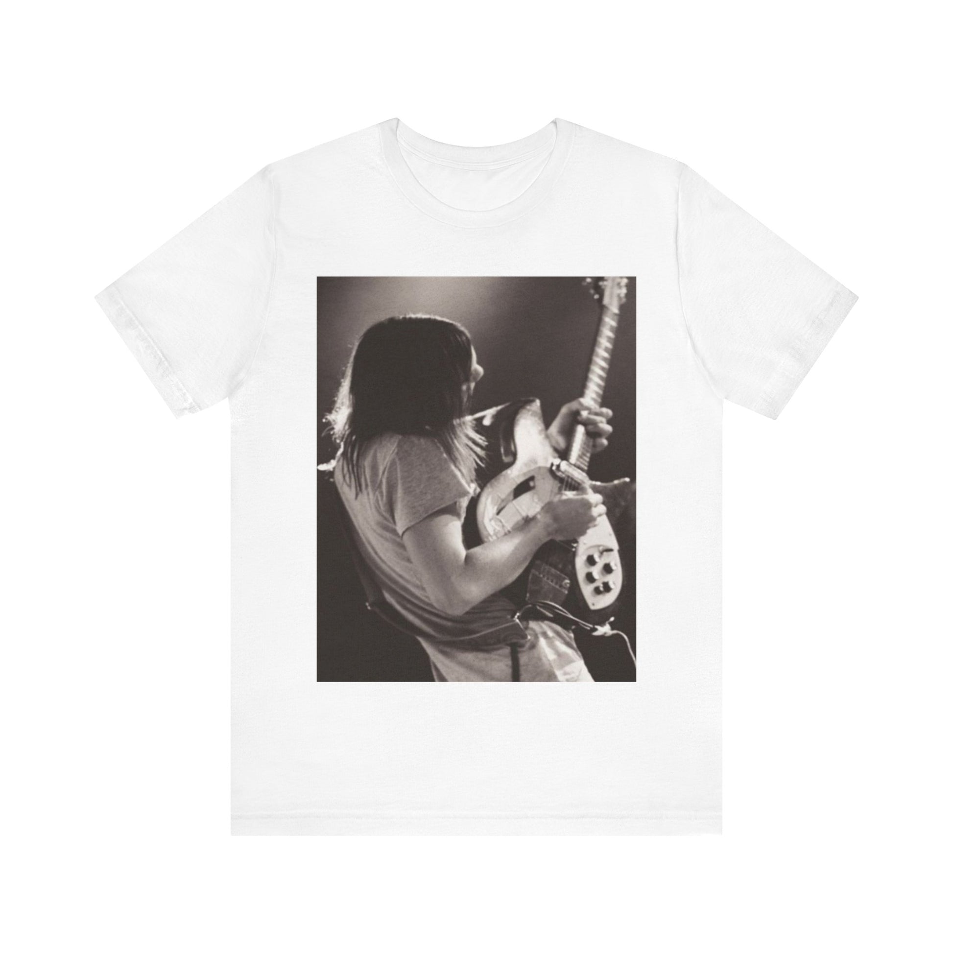 A black graphic t-shirt featuring a black and white graphic or photo of Tame Impala performing live on stage.