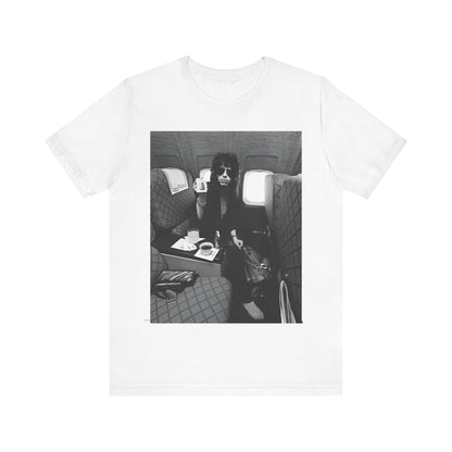 A black graphic t-shirt featuring a vintage 70s-style illustration of an airplane with Aerosmith branding, representing their tour plane from that era.