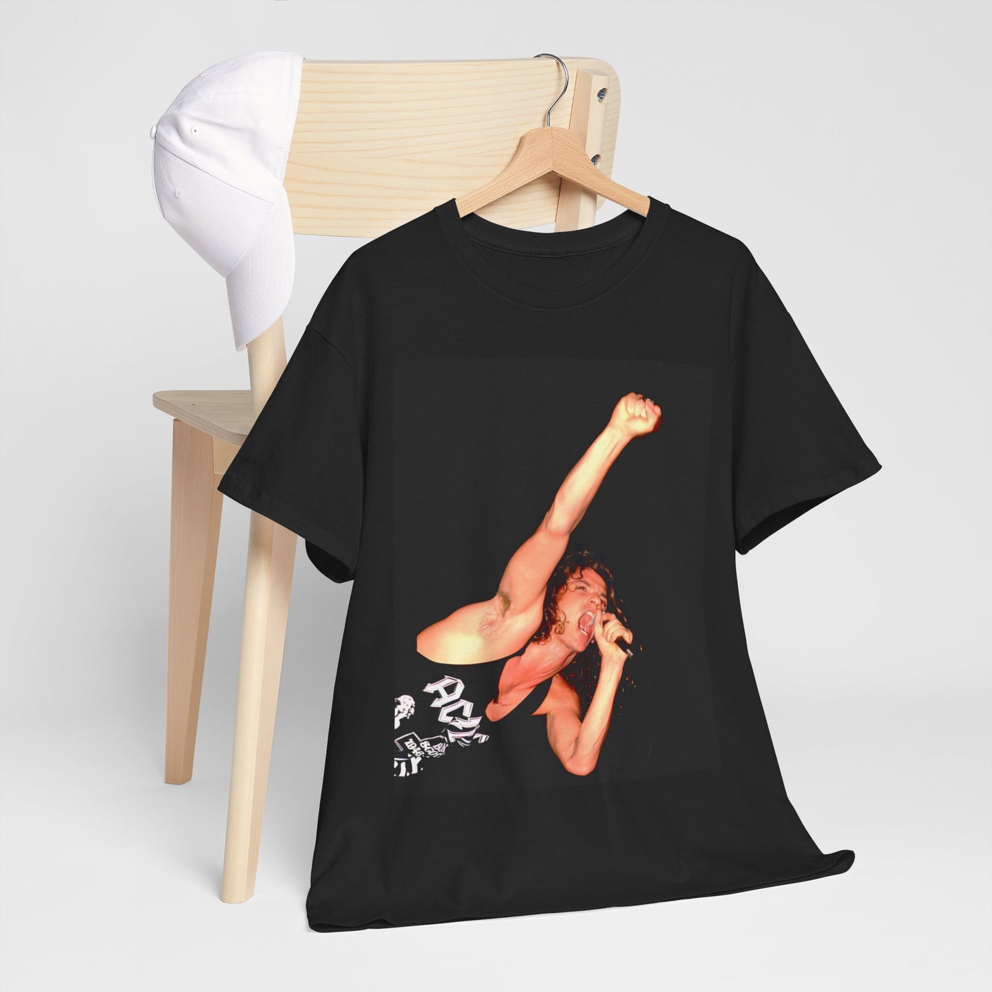 A black graphic t-shirt featuring a photo of Michael Hutchence from INXS performing live in concert.