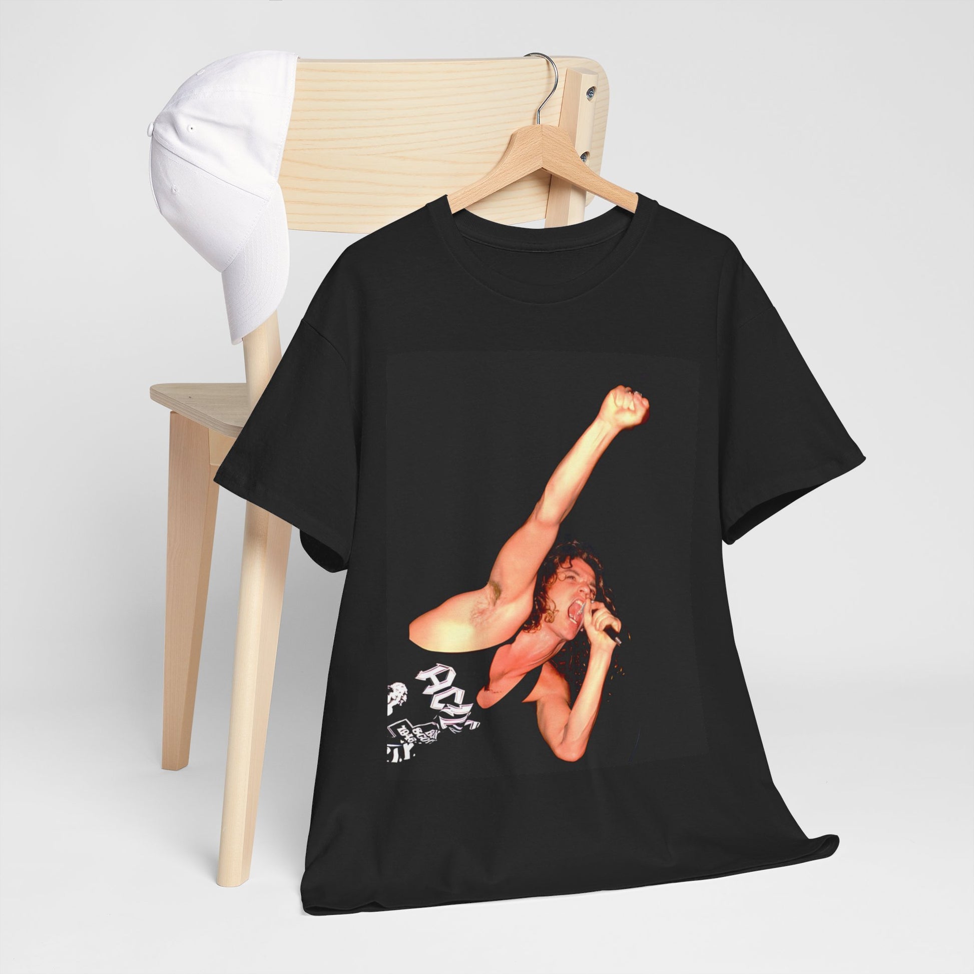 A black graphic t-shirt featuring a photo of Michael Hutchence from INXS performing live in concert.