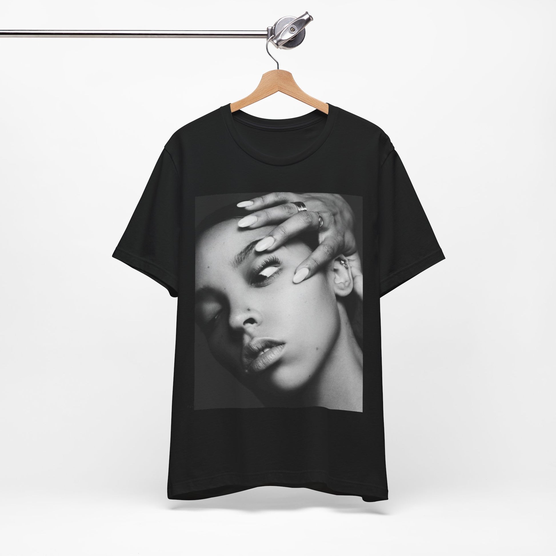 A black graphic t-shirt featuring a black and white, monochrome graphic or photo of Tinashe.