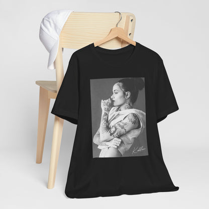 A black graphic t-shirt featuring a black and white, monochrome graphic or photo of Kehlani.