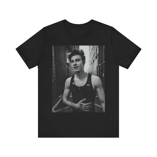 A black graphic t-shirt featuring a vintage black and white portrait graphic or photo of Shawn Mendes.