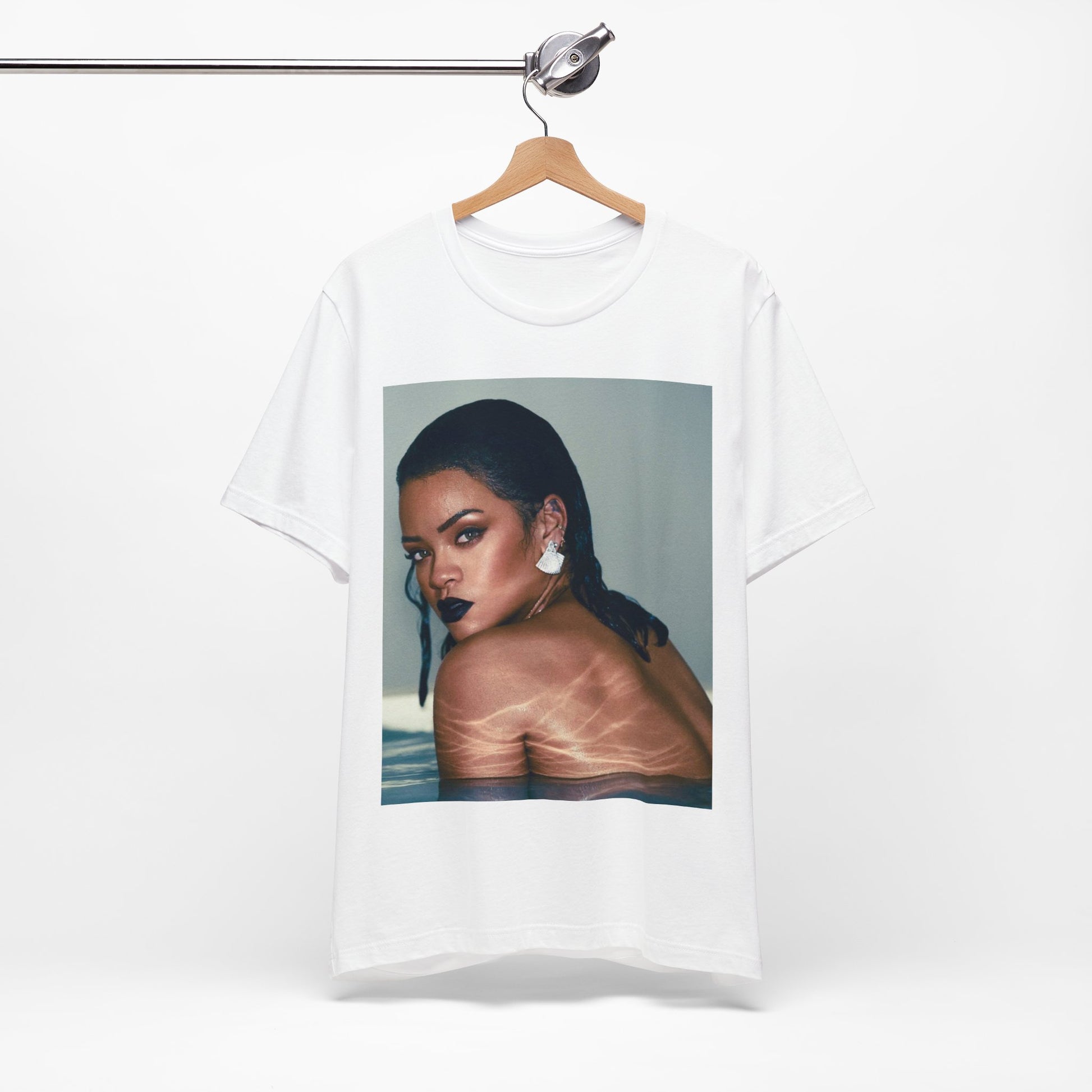A black graphic t-shirt featuring a vintage pop icon graphic of Rihanna.