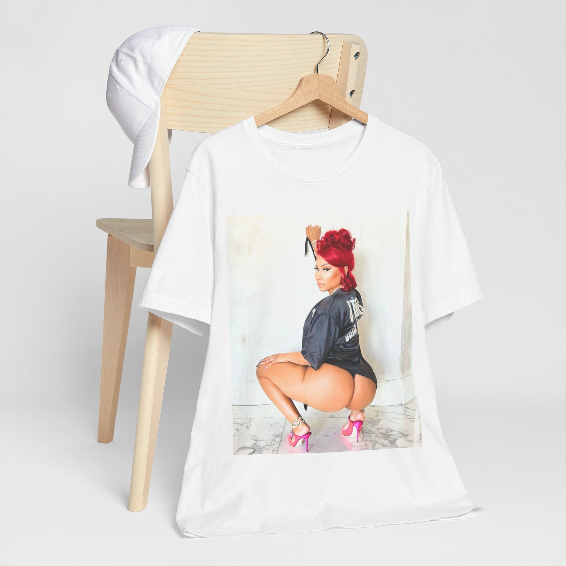 A black graphic t-shirt featuring a graphic of Nicki Minaj in an iconic power pose.