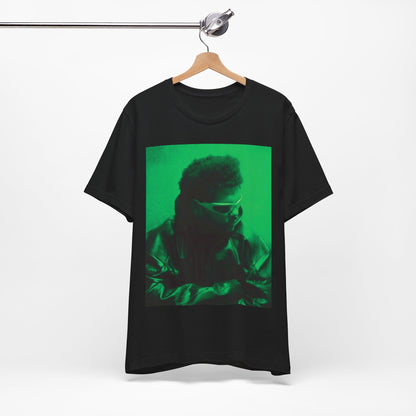 A black graphic t-shirt featuring a vintage graphic related to The Weeknd's 'Kiss Land' era.