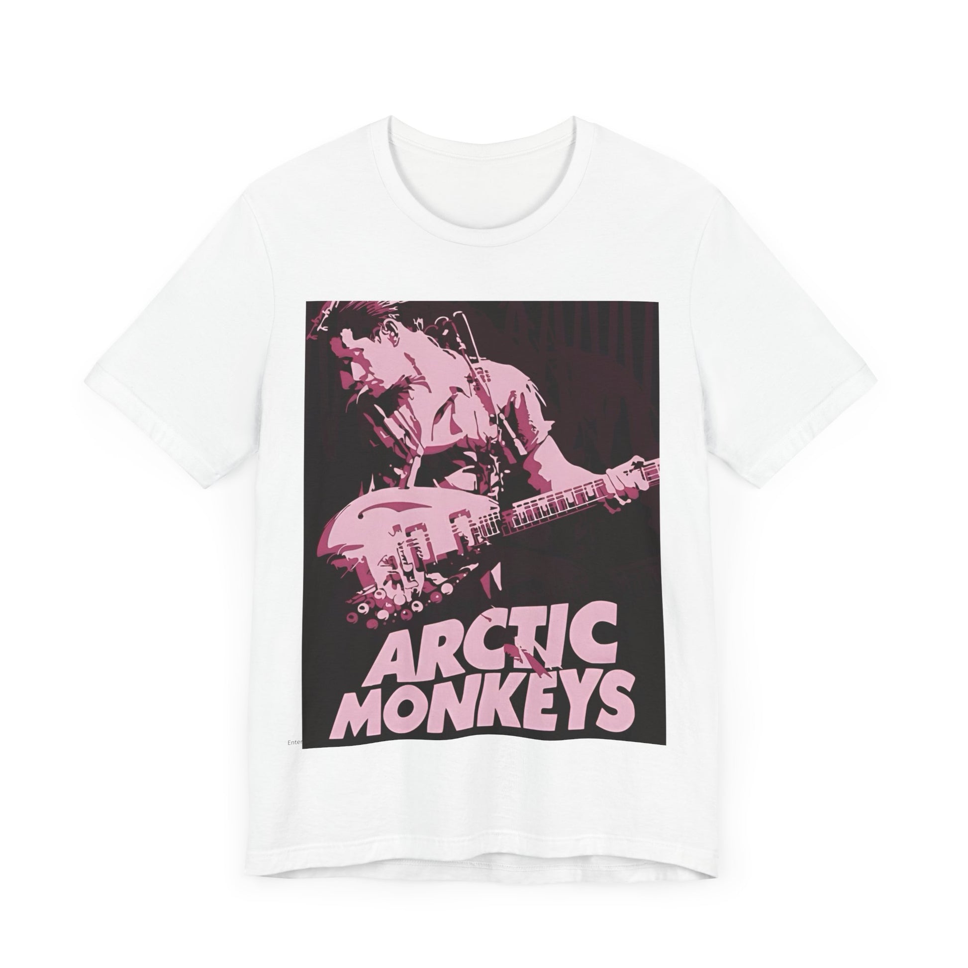 A black graphic t-shirt featuring the Arctic Monkeys logo in a prominent pink color, creating an aesthetic look.