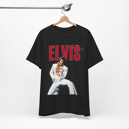 A black graphic t-shirt featuring a glamorous graphic or photo of Elvis Presley on a Las Vegas stage.