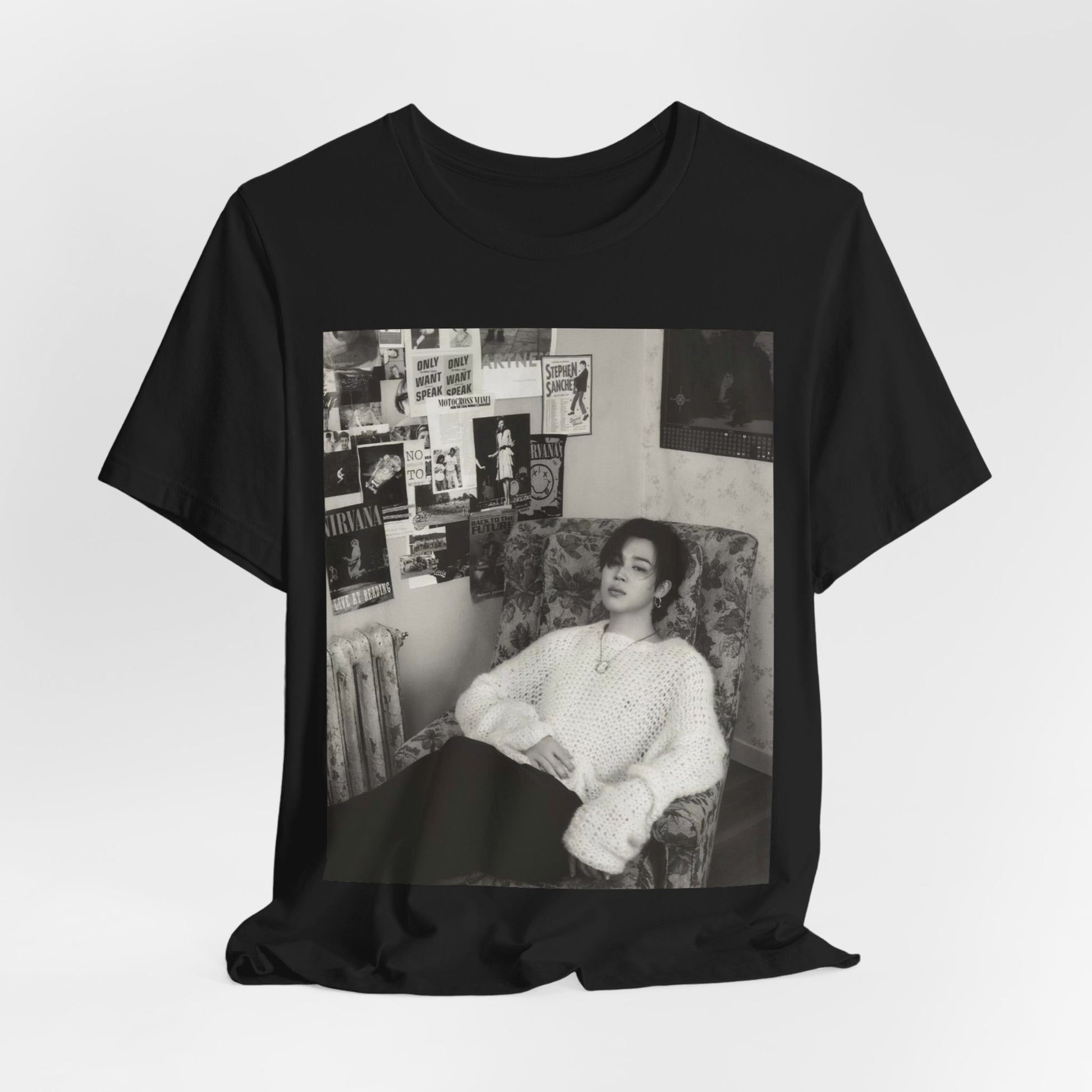 A black graphic t-shirt featuring a black and white portrait photo of Jimin.
