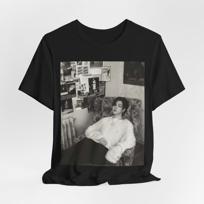 A black graphic t-shirt featuring a black and white portrait photo of Jimin.