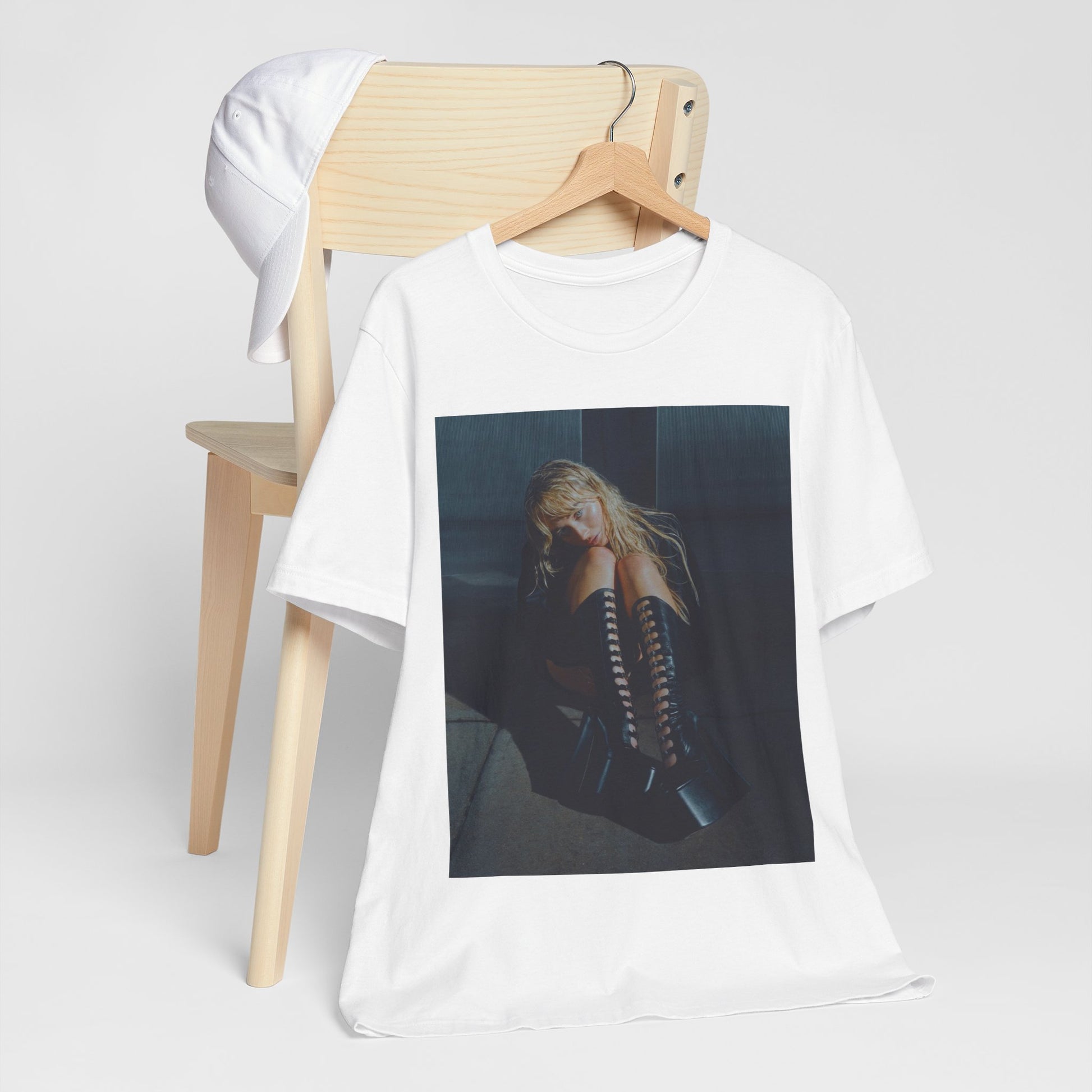A black graphic t-shirt featuring a bold graphic of Sabrina Carpenter as a pop superstar.