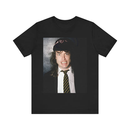 A black vintage-style graphic t-shirt featuring a stylized image of AC/DC's Angus Young playing guitar, with a distressed or retro aesthetic.
