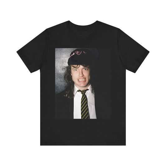 A black vintage-style graphic t-shirt featuring a stylized image of AC/DC's Angus Young playing guitar, with a distressed or retro aesthetic.