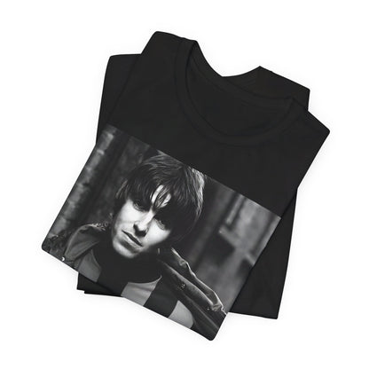 A black graphic t-shirt featuring a photo of Liam Gallagher from Oasis, showing his support for Manchester City.