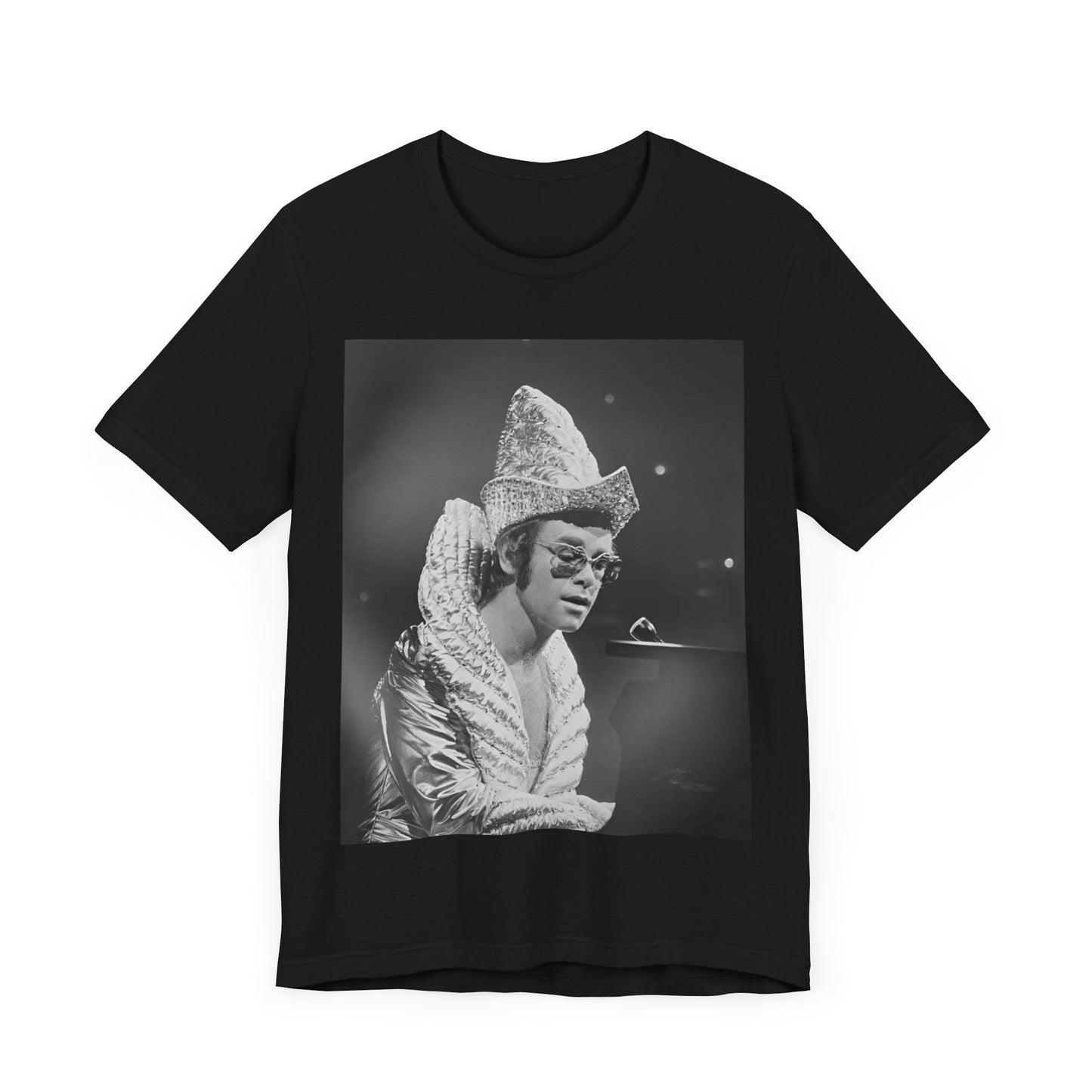 A black graphic t-shirt featuring a 70s pop aesthetic graphic of Elton John.
