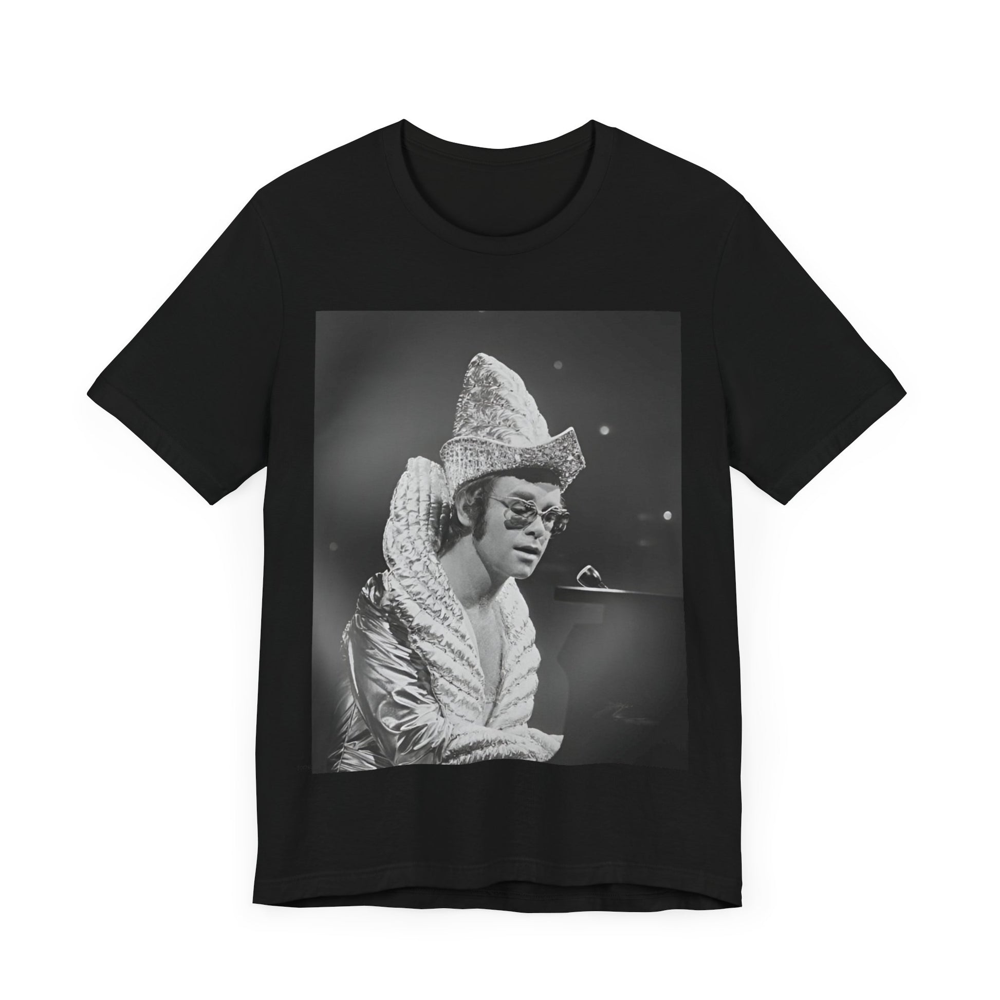 A black graphic t-shirt featuring a 70s pop aesthetic graphic of Elton John.