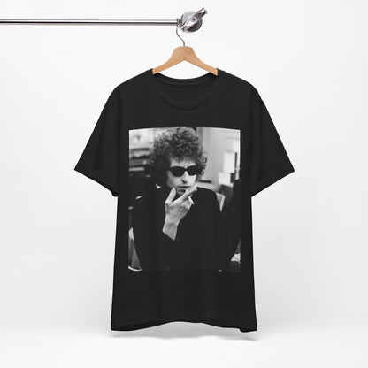 A black graphic t-shirt featuring a retro black and white graphic of Bob Dylan in a rebellious pose.